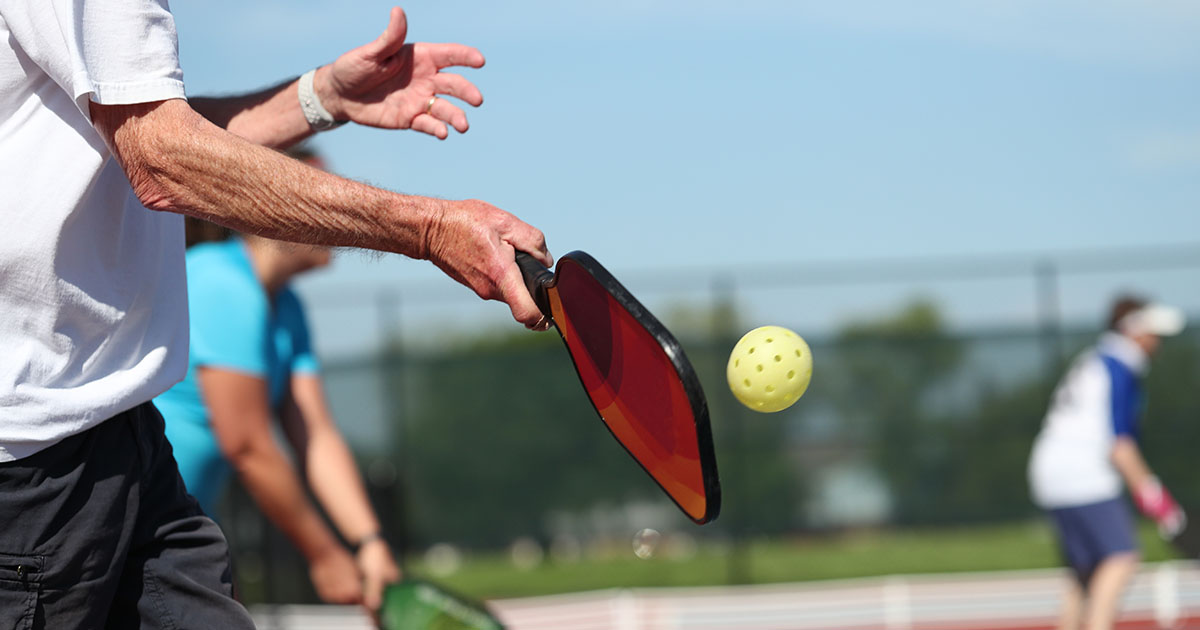 Pickleball is played outdoors